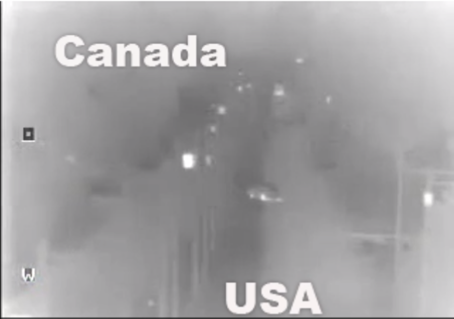caption: A still image from a surveillance video U.S. Customs and Border Protection officials say shows a British family of seven crossing illegally from Canada into the U.S.