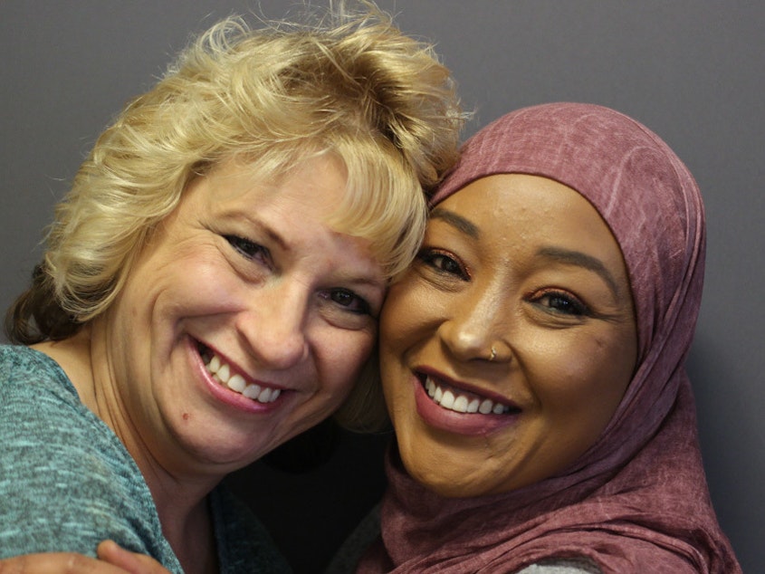 caption: Dawn Sahr (left) and Asma Jama met for the first time at their 2016 StoryCorps interview in Minneapolis. They say they're friends for life.