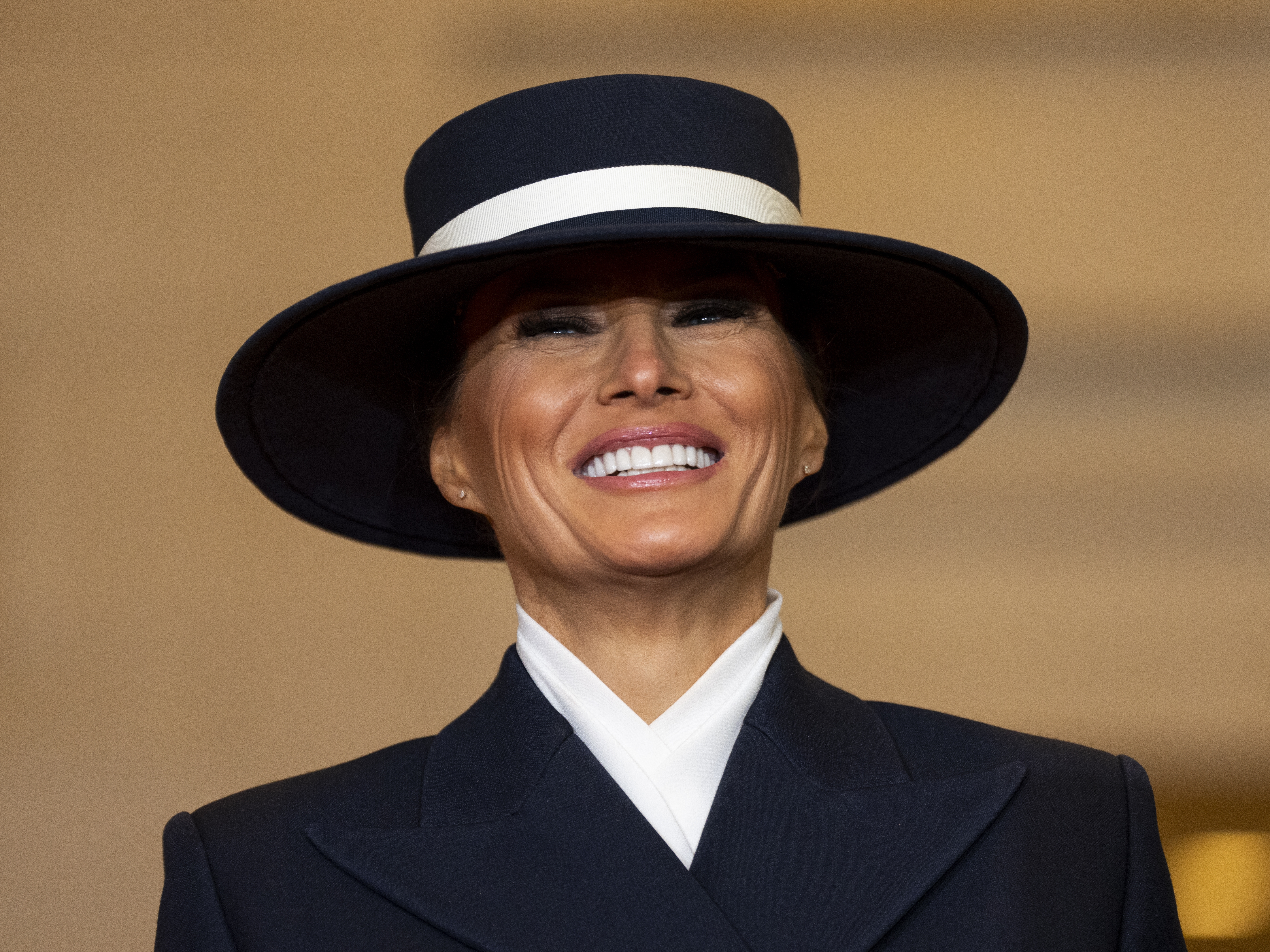 caption: First lady Melania Trump looks on as President Donald Trump delivers remarks in Emancipation Hall during inauguration ceremonies at the U.S. Capitol on Inauguration Day.