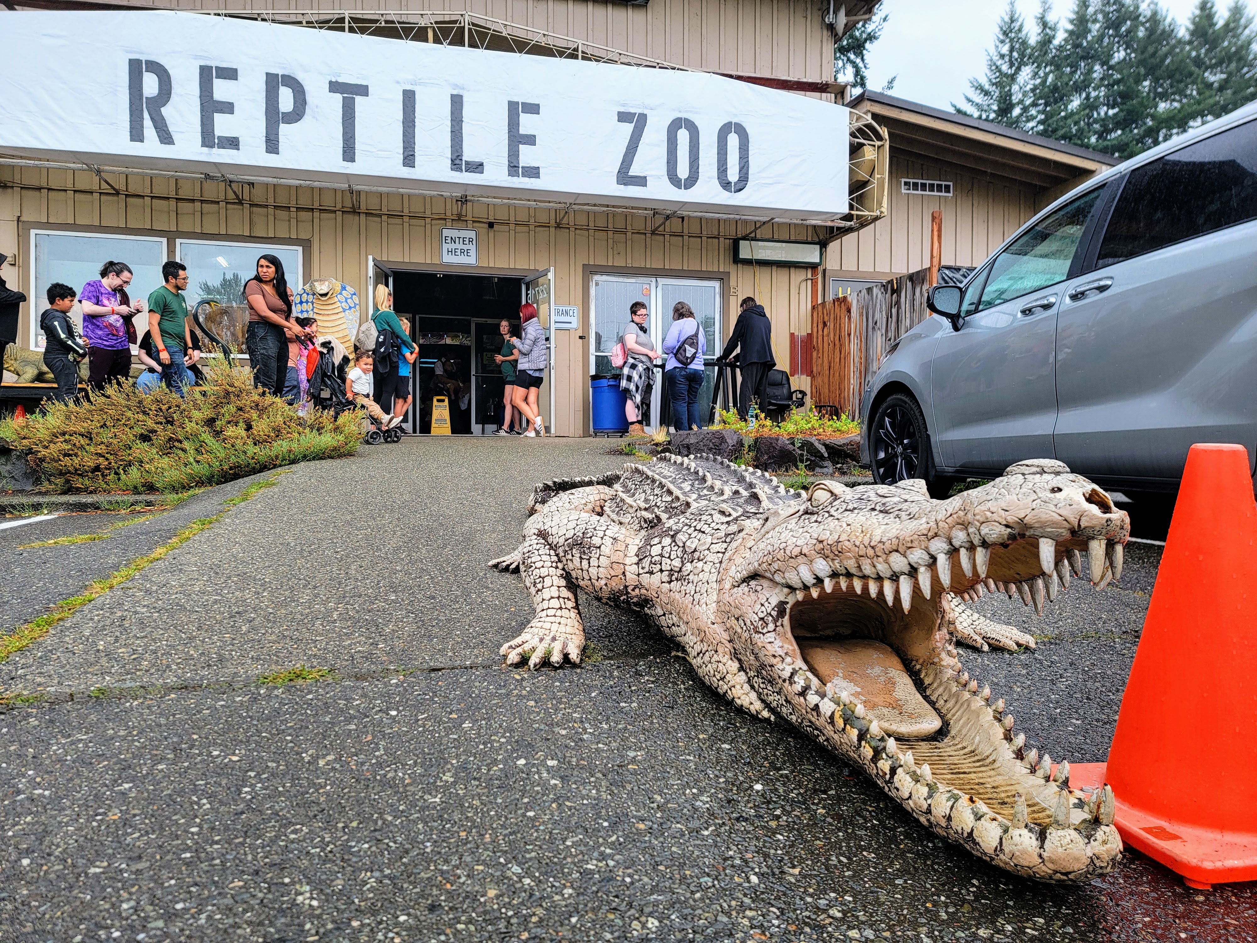 caption: Families wait outside to enter the Reptile Zoo on Friday, August 15, 2025.