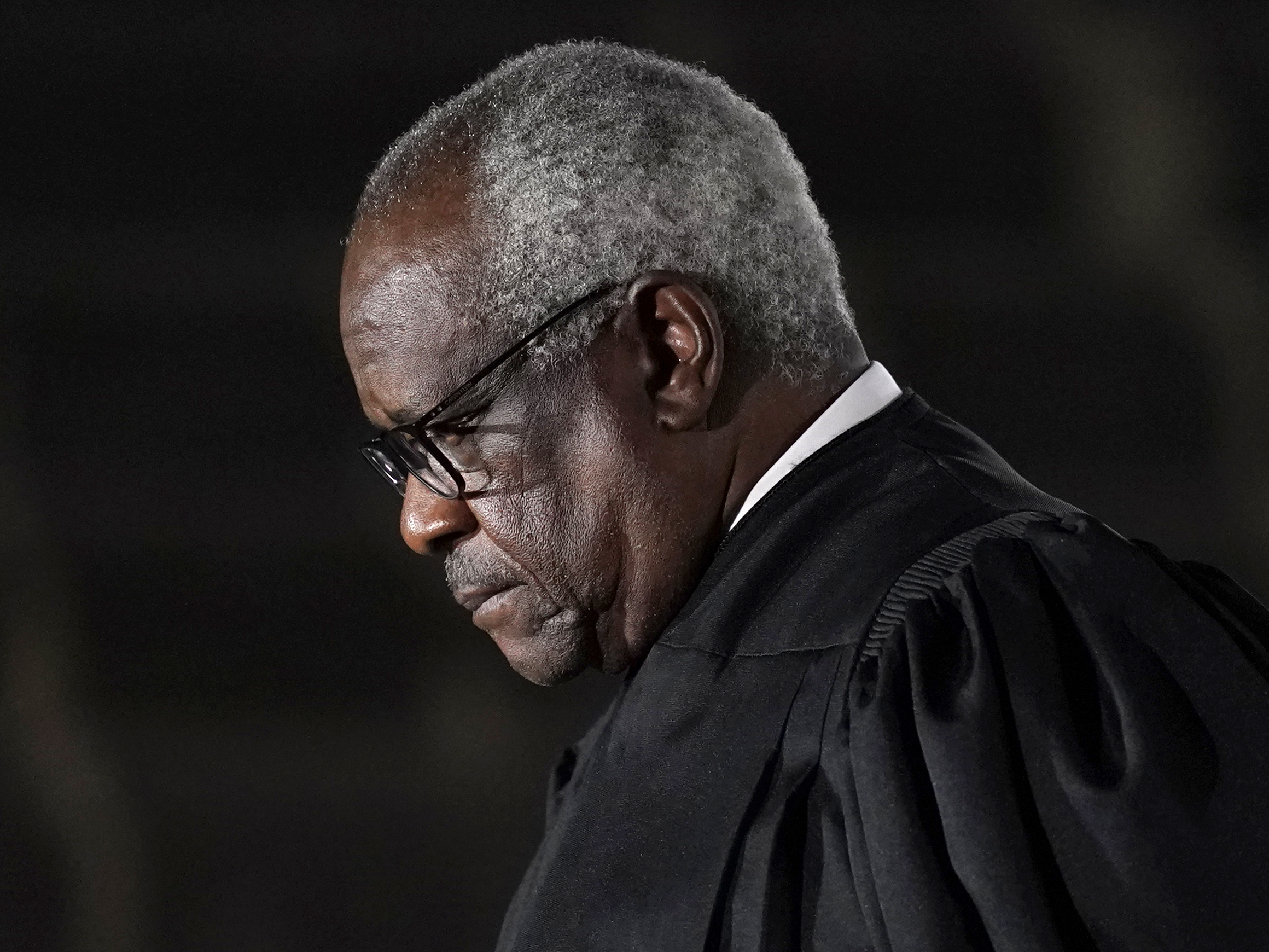 caption: Supreme Court Justice Clarence Thomas issued a concurrence in a case over former President Donald Trump's Twitter account in which Thomas suggested that social media companies should be regulated like public utilities.