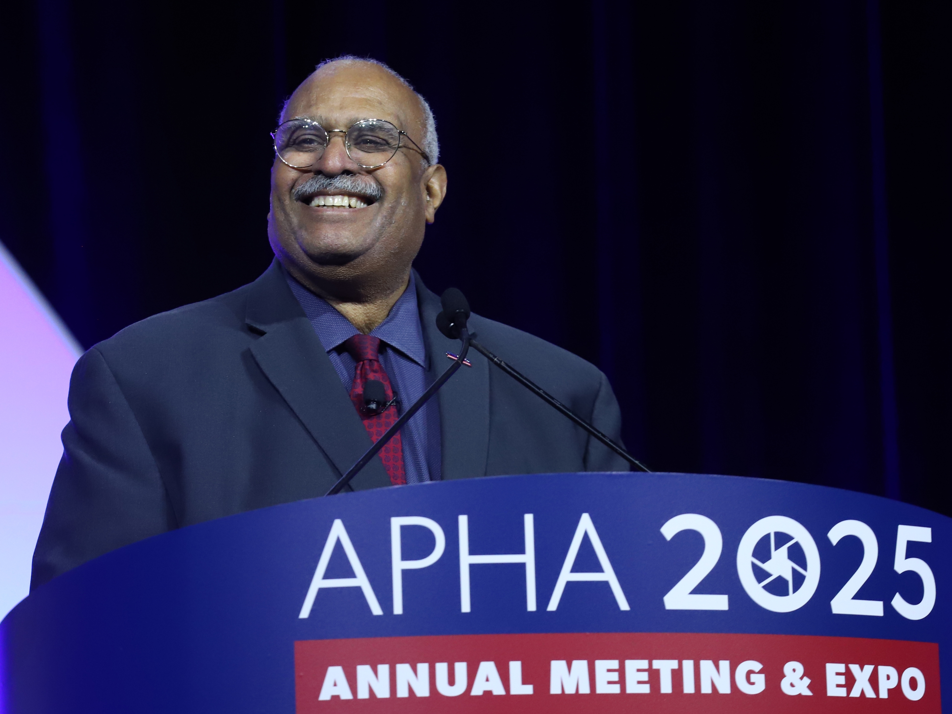 caption: Dr. Georges Benjamin speaks during the American Public Health Association meetings in Washington, D.C.