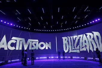 caption: The Activision Blizzard Booth during the Electronic Entertainment Expo in Los Angeles on June 13, 2013. British regulators have blocked Microsoft's $69 billion deal to buy the video game maker over worries that it would stifle competition in the cloud gaming market.
