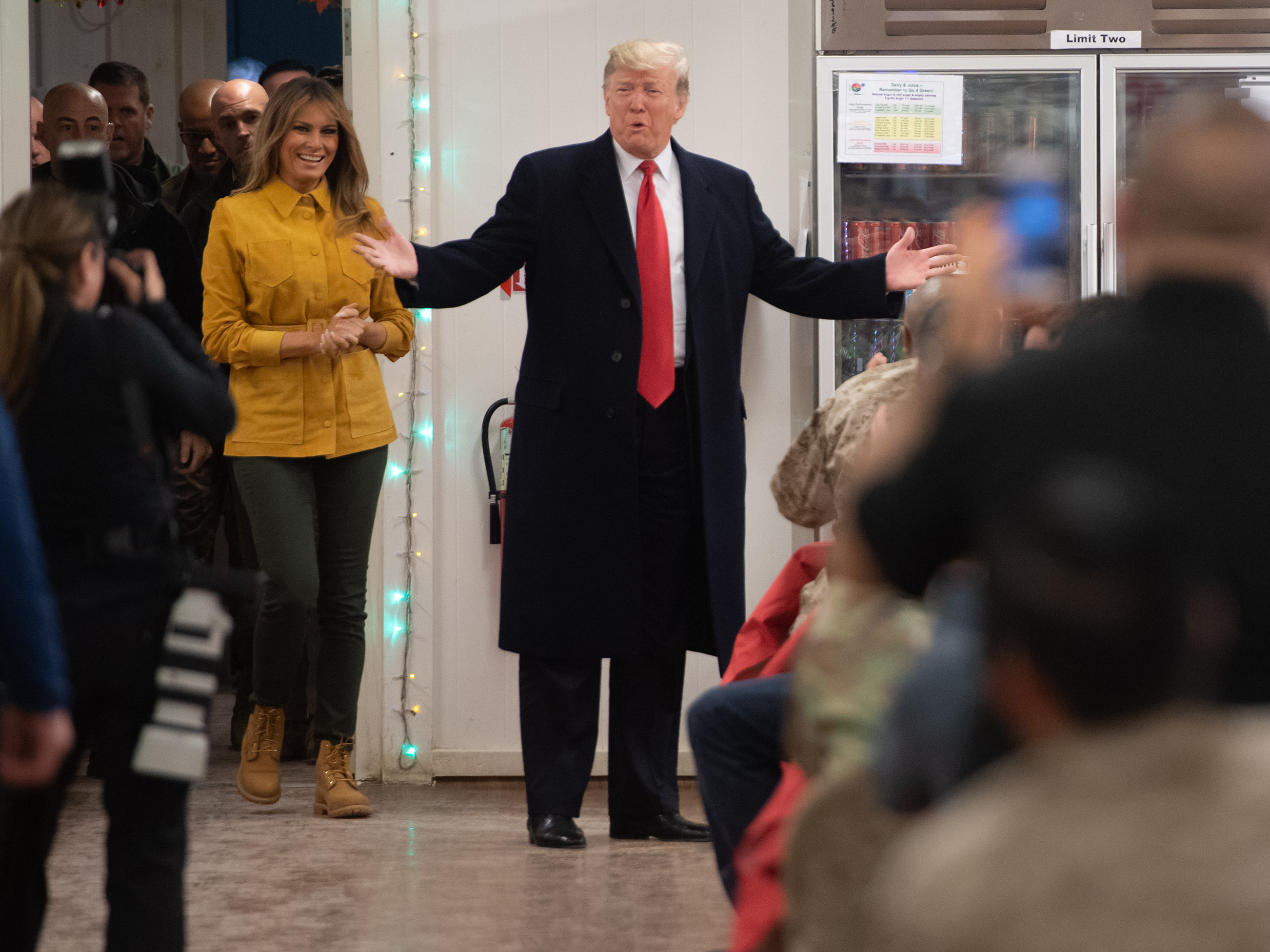 caption: President Trump and first lady Melania Trump arrive to visit members of the U.S. military during an unannounced trip to Al Asad Air Base in Iraq on Wednesday. Reporters traveling with Trump, as has happened with past presidents, were not allowed to report that the president was in Iraq until the end of the visit for security purposes.