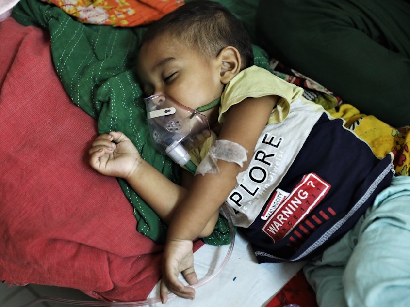 caption: A baby who is suffering from pneumonia receives treatment  at a hospital in Dhaka, Bangladesh on January 13, 2022. A new study points to concerns about childhood deaths after a hospitalization for such diseases as pneumonia, diarrhea and malaria.