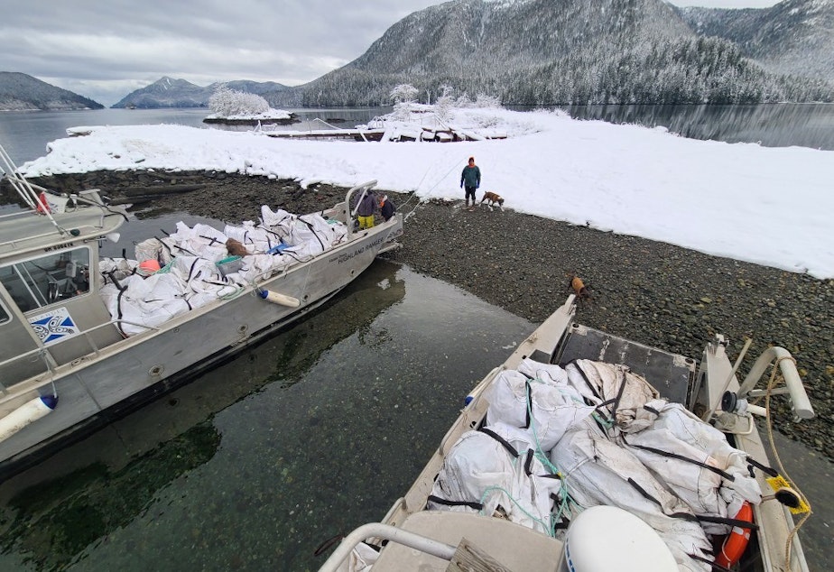 caption: Bags of marine debris gathered from beaches in Haida Gwaii, British Columbia, on Dec. 17, 2021