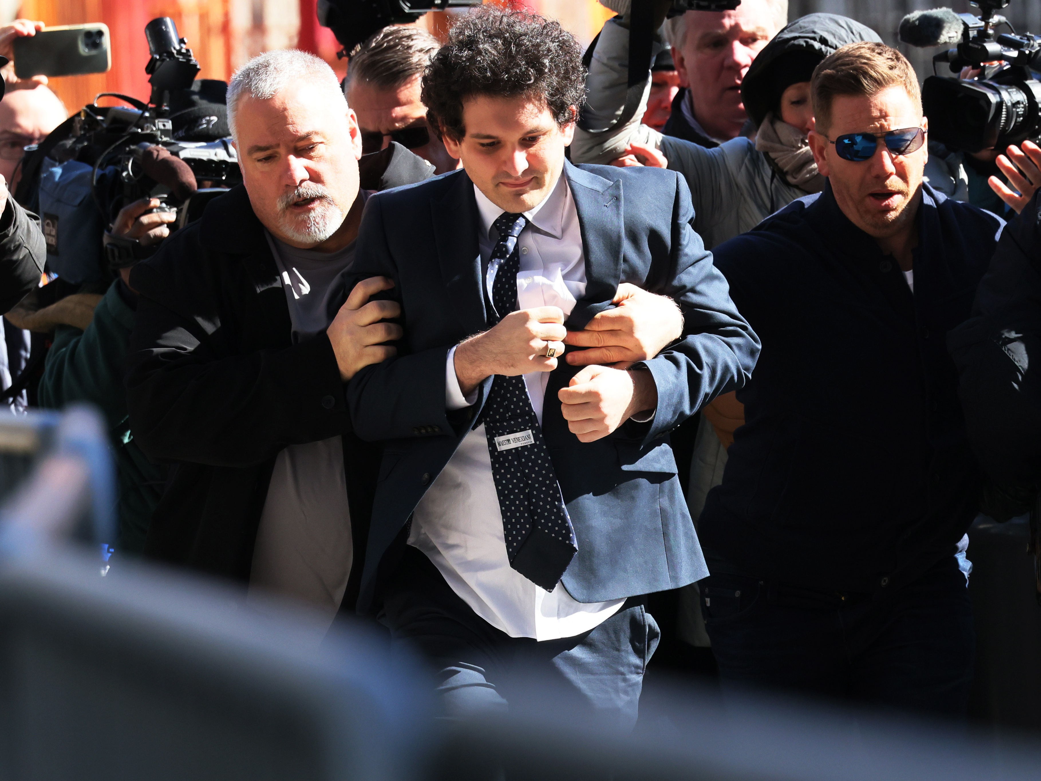 caption: Sam Bankman-Fried is accused of defrauding the company's customers, investors and lenders. He's set to take the stand on his own defense starting as early as Thursday.