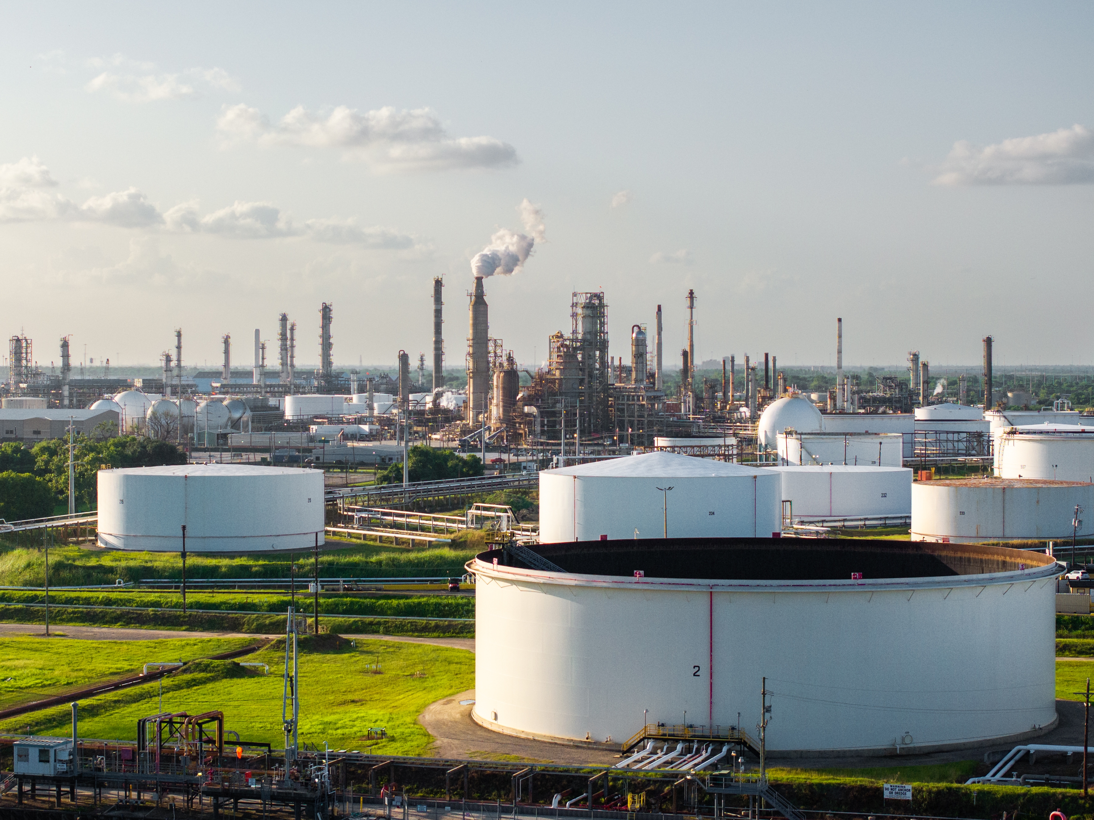 caption: The LyondellBasell Houston refinery is seen in June. Multiple factors are holding oil prices down, including the fact that the United States is now the world's largest oil producer.