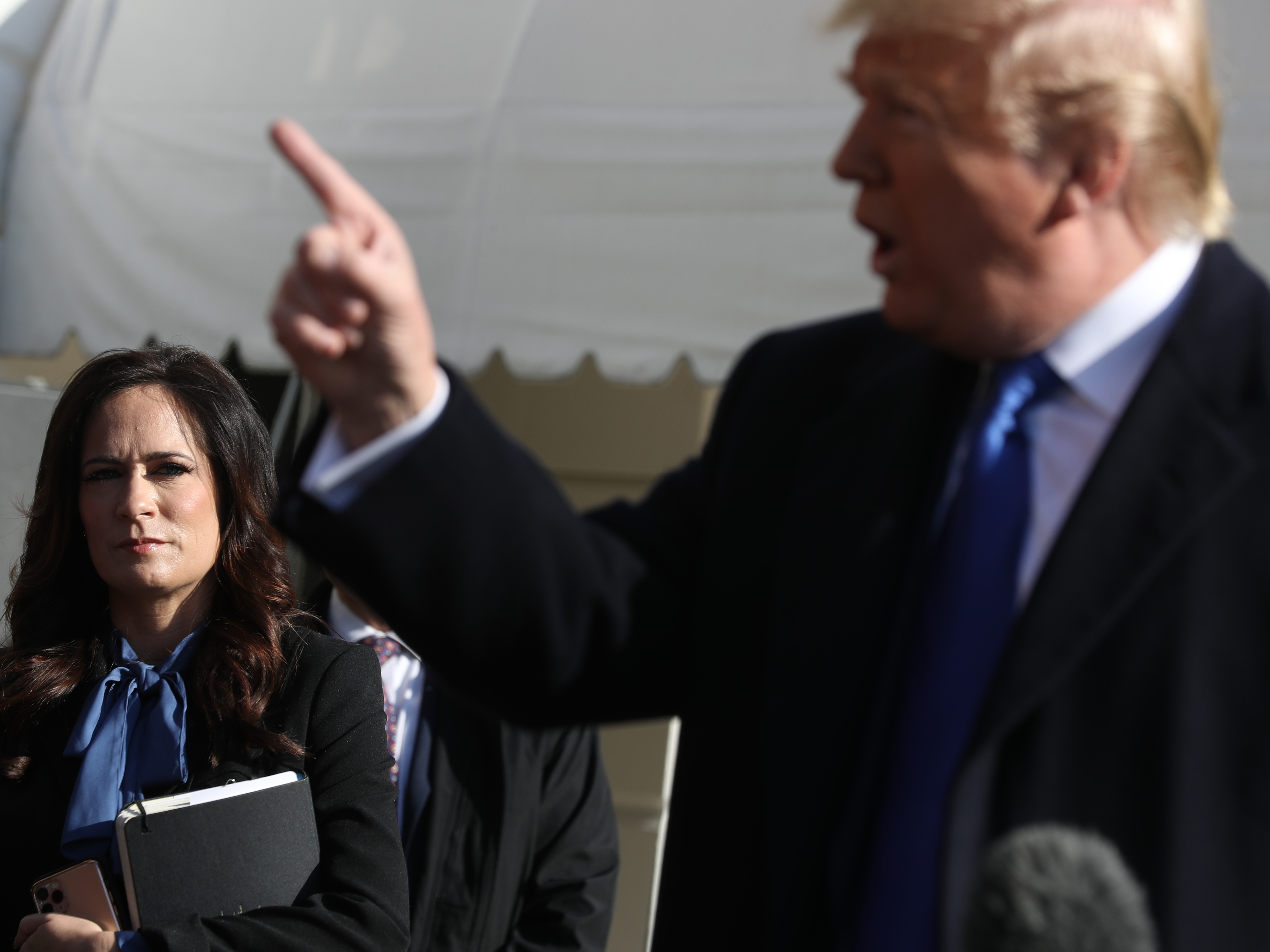 caption: White House press secretary Stephanie Grisham played a more behind-the-scenes role for Trump than his two previous spokespersons.