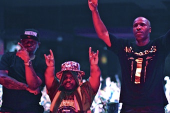 caption: Left to right: Scarface, Bushwick Bill and Willie D of the Geto Boys perform in Houston in 2015.