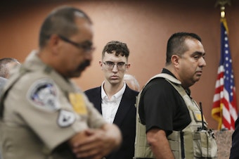 caption: El Paso Walmart shooting suspect Patrick Crusius, shown here during his capital murder arraignment in El Paso, Texas, is accused of killing 22 people.