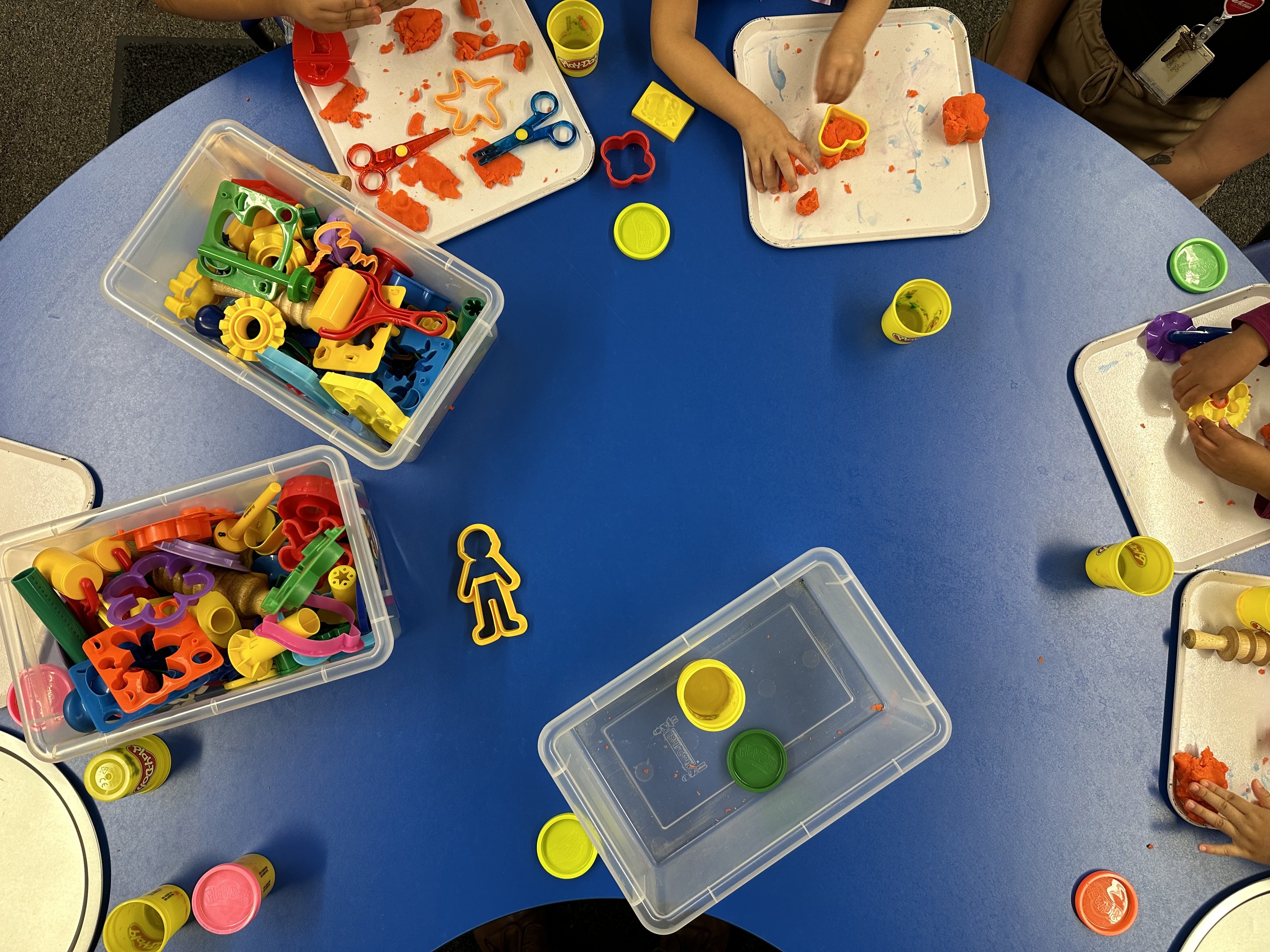 caption: Children play with Play-Doh at a Head Start center in Michigan.