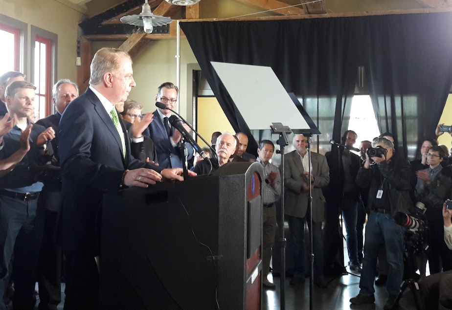 caption: Seattle Mayor Ed Murray announces he will not run for re-election. He was flanked by supporters and officials at the Alki Beach Bathhouse on Tuesday. 