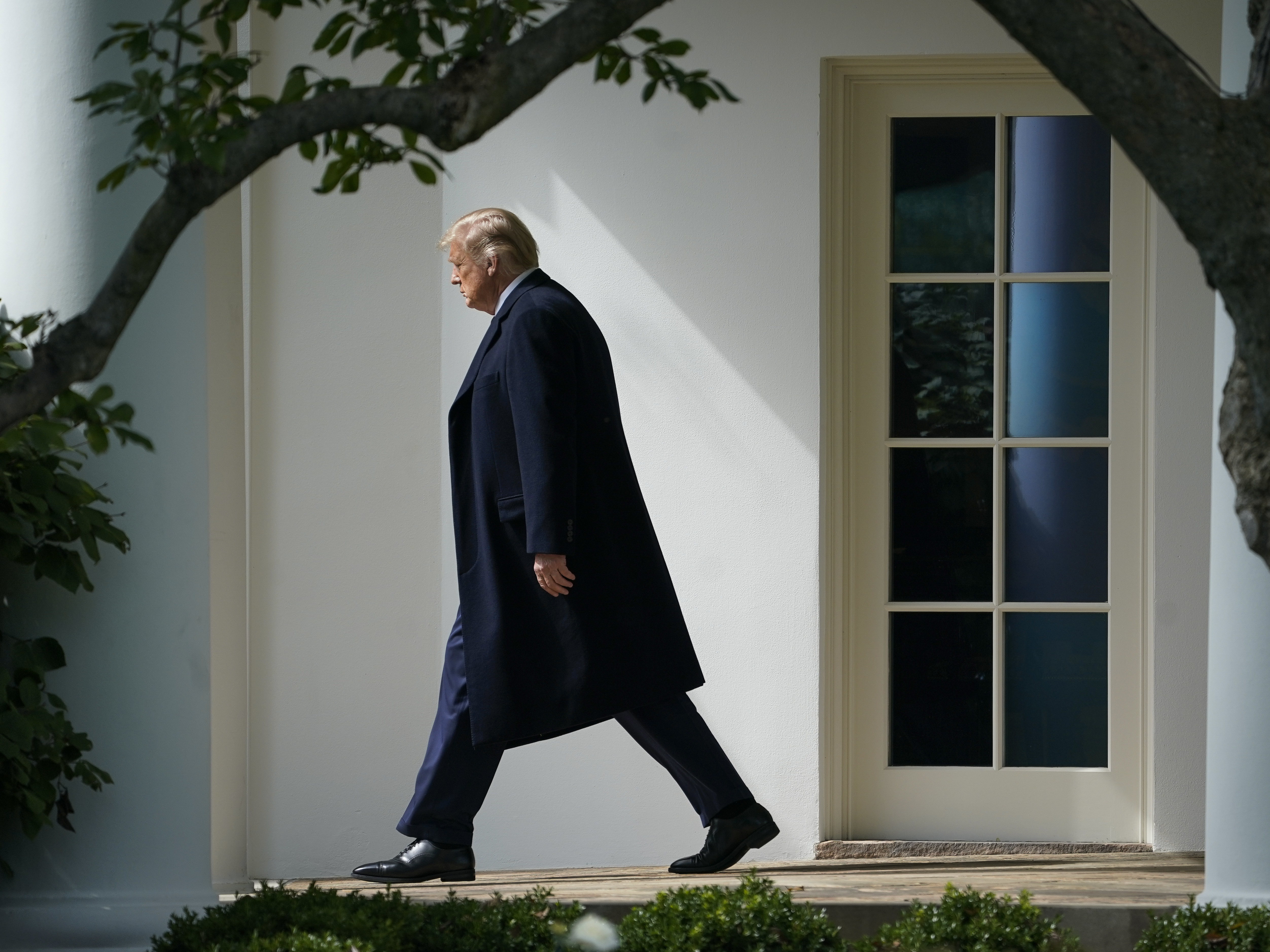 caption: President Trump exits the Oval Office and walks to the South Lawn of the White House on Oct. 1. As he leaves the White House for the final time, Trump has rescinded rules prohibiting members of his administration from lobbying agencies where they worked for five years.