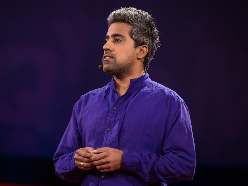 caption: Anand Giridharadas on the TED stage.