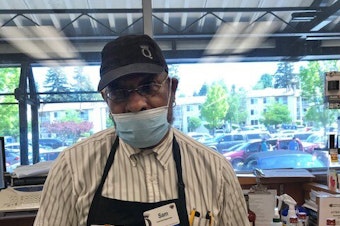 caption: Sam Dancy at the Westwood Village QFC. He has been working in the grocery industry for three decades. 