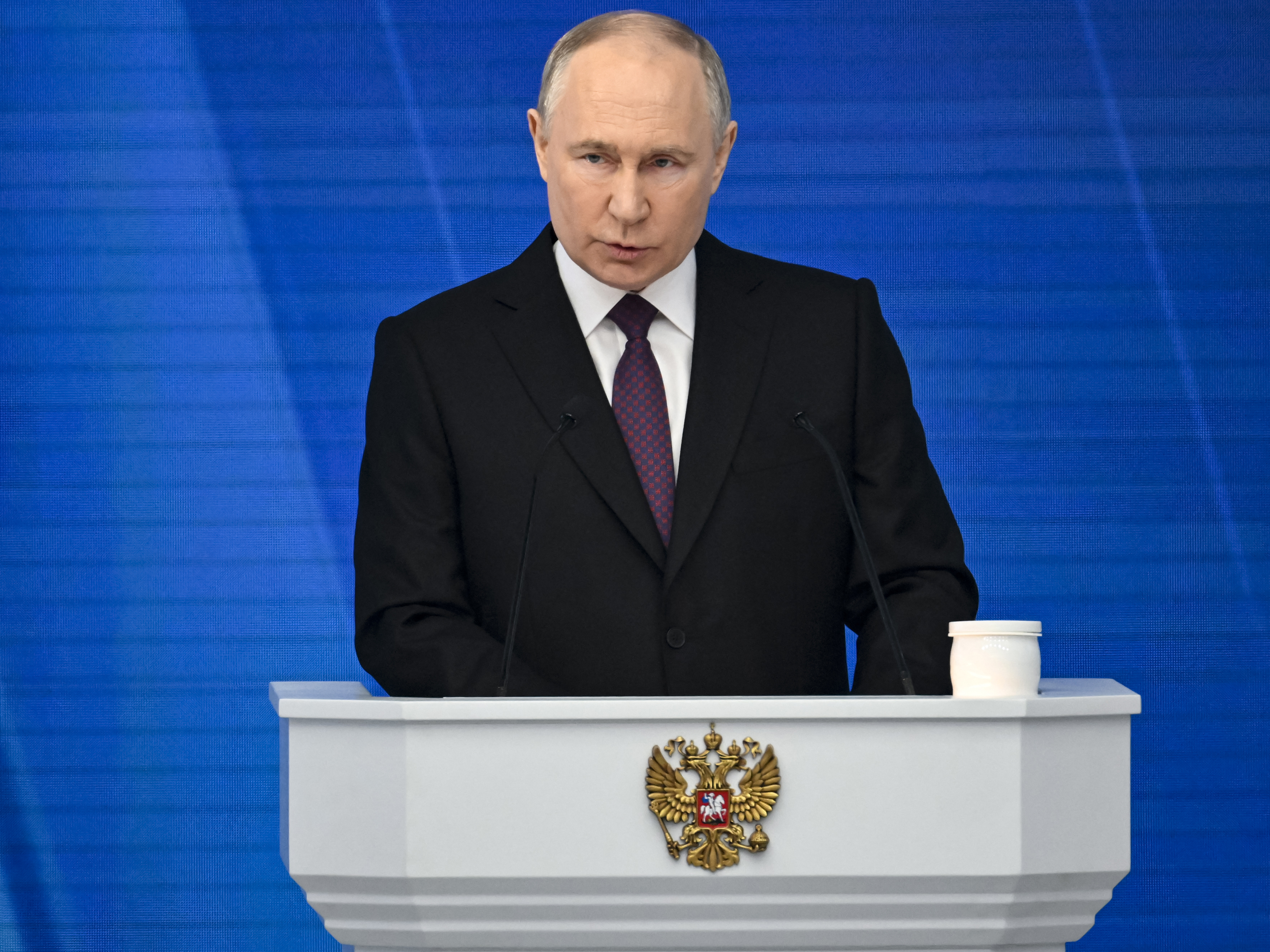 caption: Russian President Vladimir Putin delivers his annual state of the nation address in Moscow on Thursday.