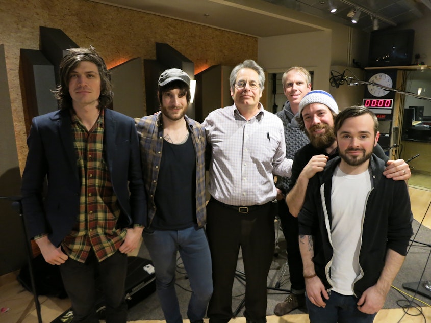 caption: (Left to right) Sam Miller, Chris Cunningham, KUOW's Steve Scher, Nicolas Danielson, Matt Badger and Brantley Duke at the KUOW studios. Miller, Cunningham, Badger and Duke are members of the Northwest indie rock band, Ravenna Woods. Danielson is a Seattle-based musician, composer and sound designer. 