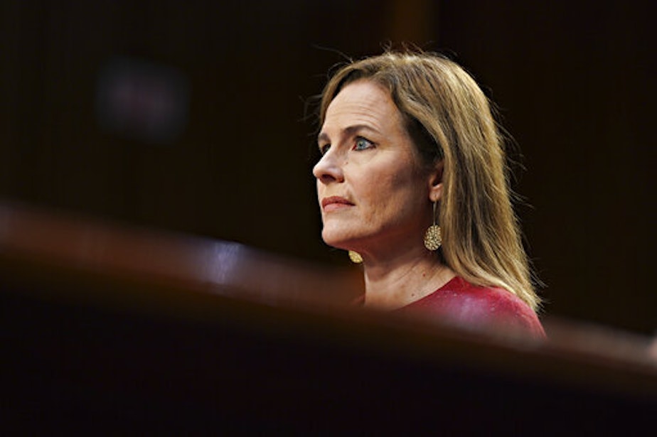 caption: Supreme Court nominee Amy Coney Barrett listens during a confirmation hearing before the Senate Judiciary Committee, Tuesday, Oct. 13, 2020, on Capitol Hill in Washington. 
