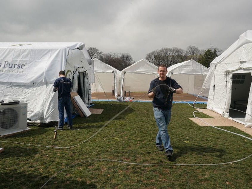 caption: Volunteers from the relief organization Samaritan's Purse set up an emergency field hospital in New York's Central Park on Monday.