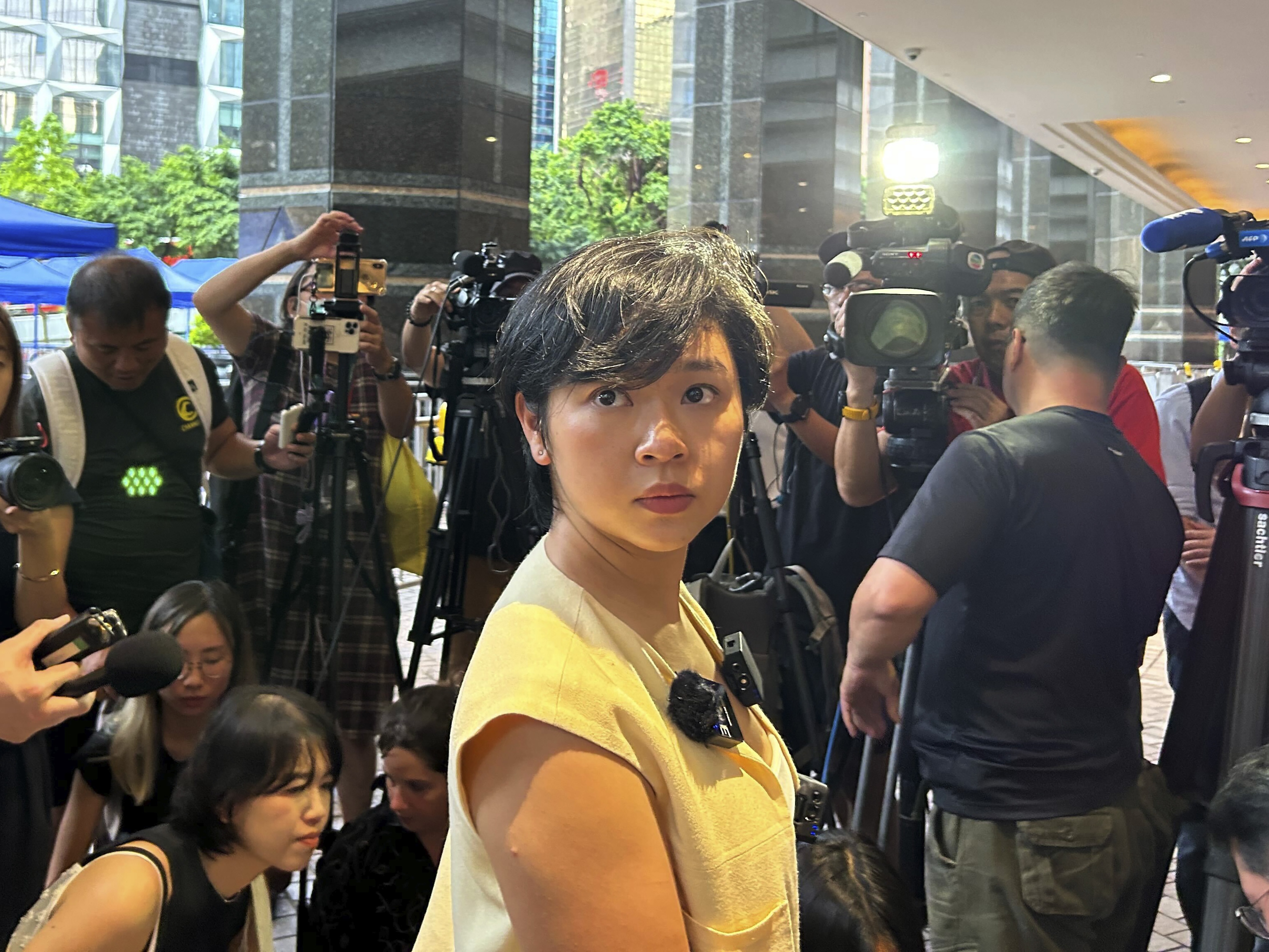 caption: Selina Cheng, newly elected chairperson of the Hong Kong Journalists Association, speaks to media in Hong Kong on Wednesday. Cheng said she lost her job at <em>The Wall Street Journal</em> after she refused her supervisor’s request to withdraw from the election for the leadership post.