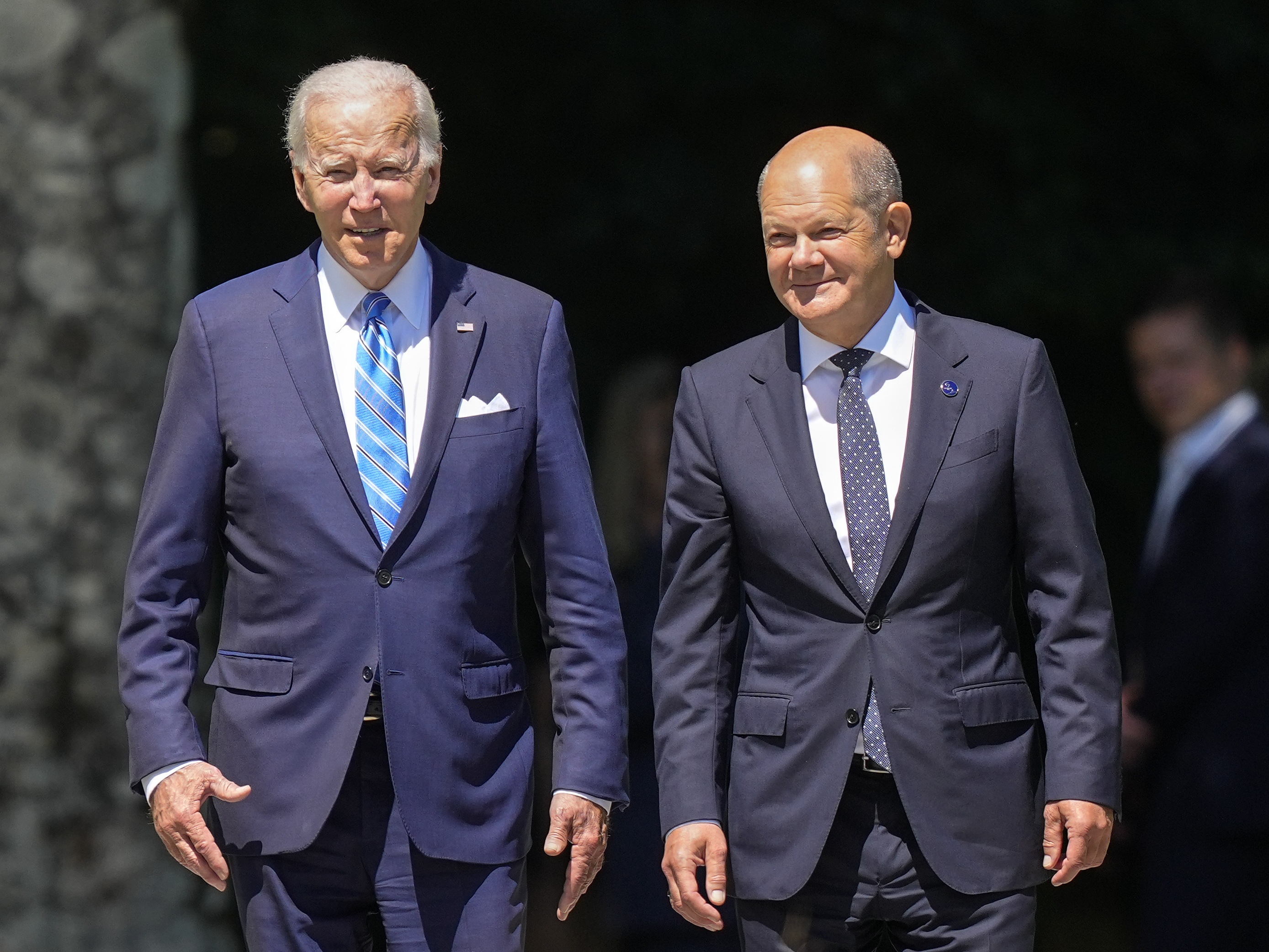 caption: President Biden and German Chancellor Olaf Scholz (right) arrive for the official Group of Seven summit welcome ceremony at Castle Elmau in Krün, Germany, on June 26, 2022.