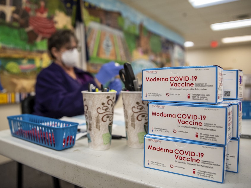 caption: A nurse prepares a dose of the Moderna COVID-19 vaccine at a San Antonio senior center in March. A panel of advisers to the Food and Drug Administration will meet Thursday to review Moderna's booster shot.