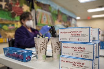 caption: A nurse prepares a dose of the Moderna COVID-19 vaccine at a San Antonio senior center in March. A panel of advisers to the Food and Drug Administration will meet Thursday to review Moderna's booster shot.