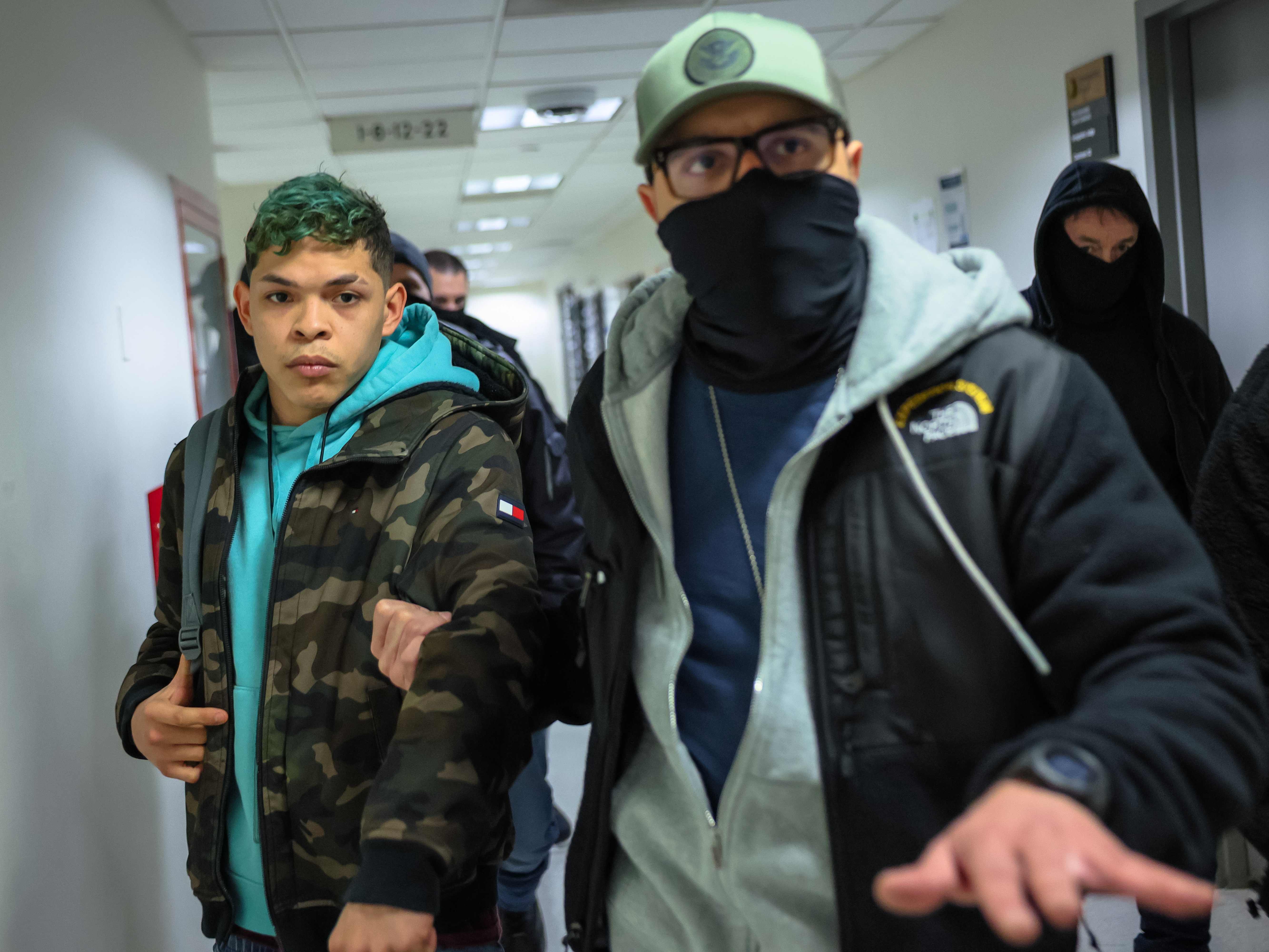 caption: A man from Venezuela is detained by masked federal agents after his hearing in immigration court at the Jacob K. Javits Federal Building on January 28, 2026 in New York City.