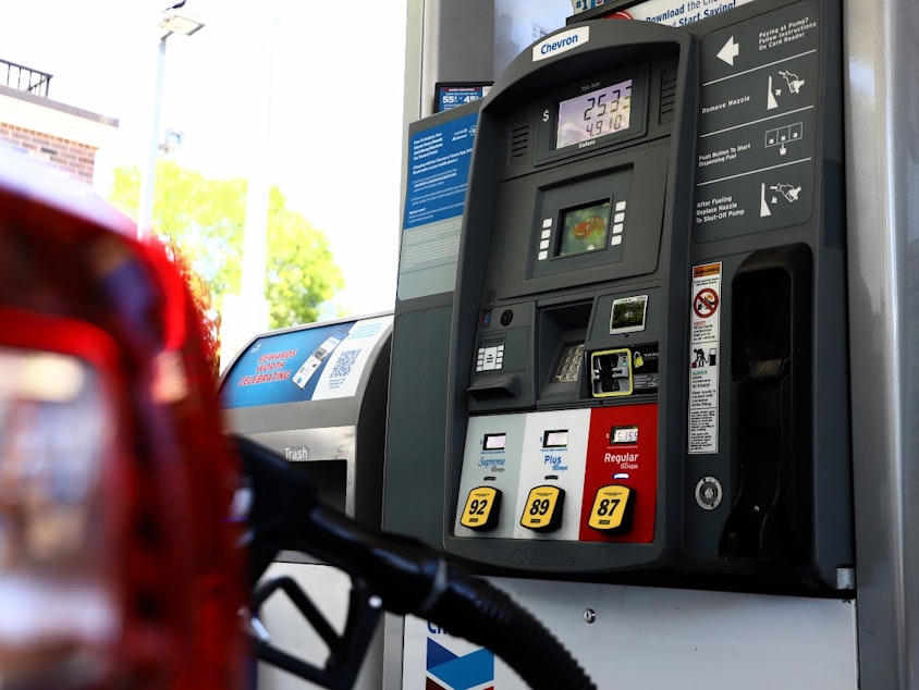 caption: Car getting gas at a gas station in the University District July 19, 2023