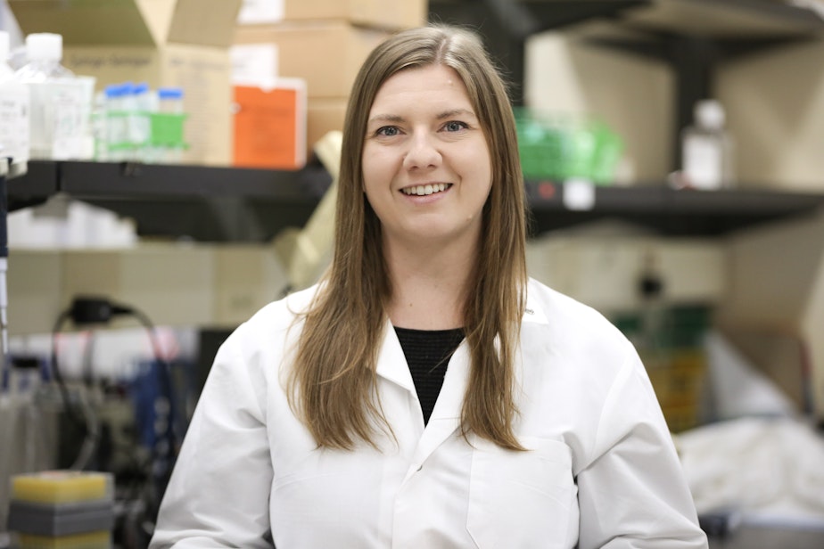 caption: Kristin Weinstein, a doctoral student in the Department of Immunology at the University of Washington School of Medicine, is shown in the lab where she conducts research. Weinstein hopes to one day have her own named lab, but that future is in doubt, at least in the U.S., due to federal funding cuts to biomedical research.