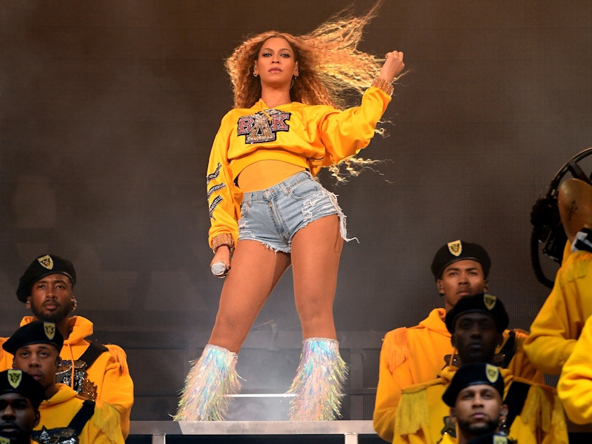 caption: Beyoncé performs onstage during Coachella on April 14, 2018.