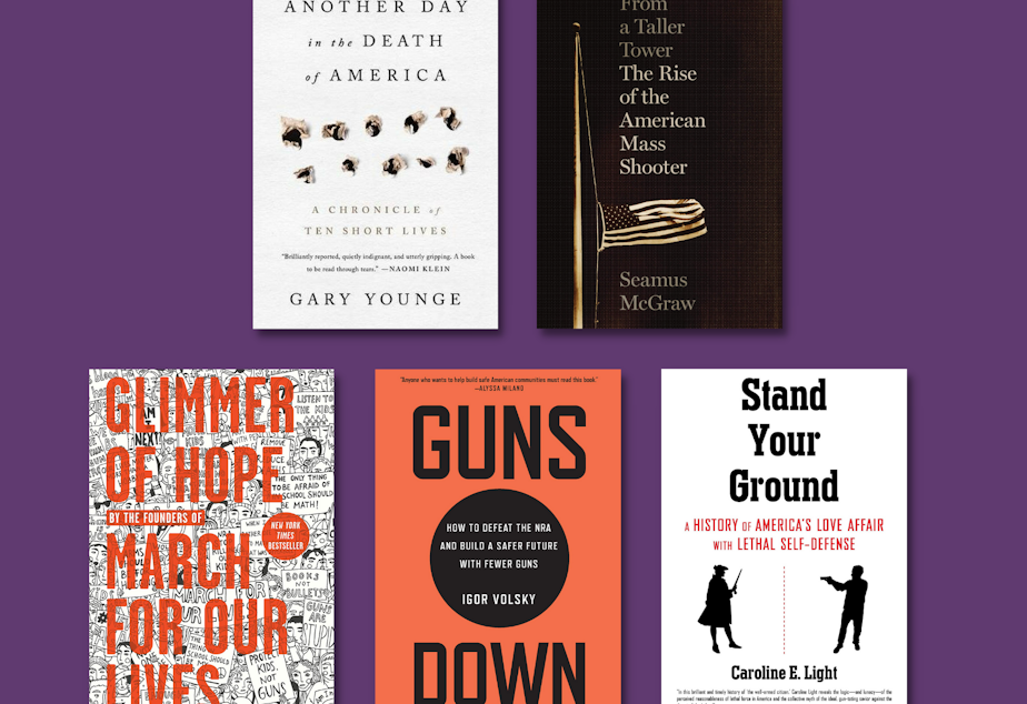 Various books against a dark purple background