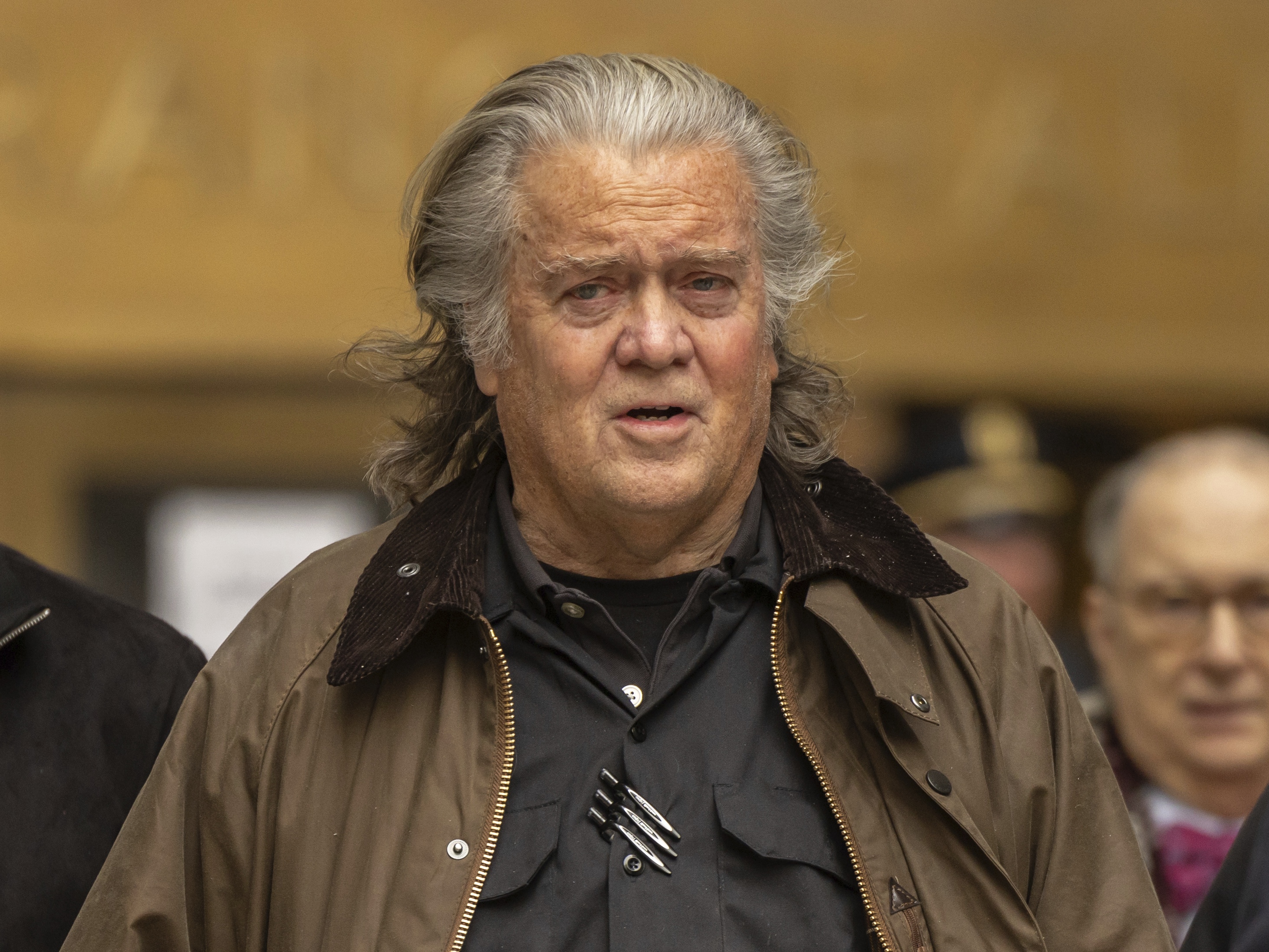 caption: Steve Bannon exits court in New York on Feb. 11, 2025.