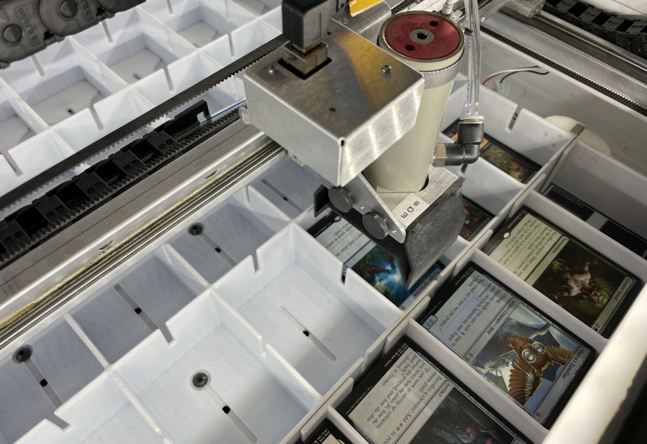 caption: A robot sorts Magic cards at Card Kingdom. Note: The company uses two kinds of robots. This one is an open source robot. The one John Morris and his staff developed during the pandemic is much bigger, about the size of a car garage, but the company wouldn't allow photos because it's proprietary.
