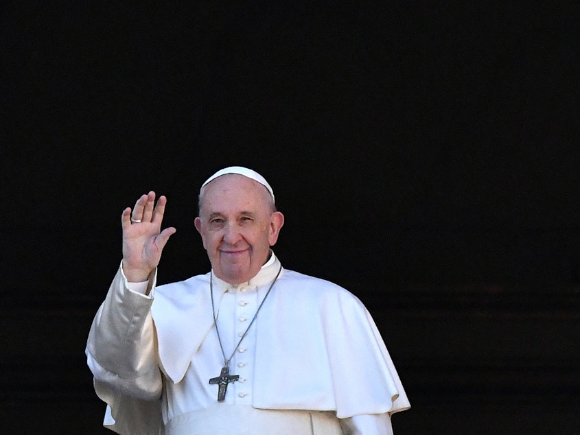 caption: Pope Francis called for compassion toward migrants in a Christmas Day speech from the balcony of St. Peter's Basilica in Vatican City.