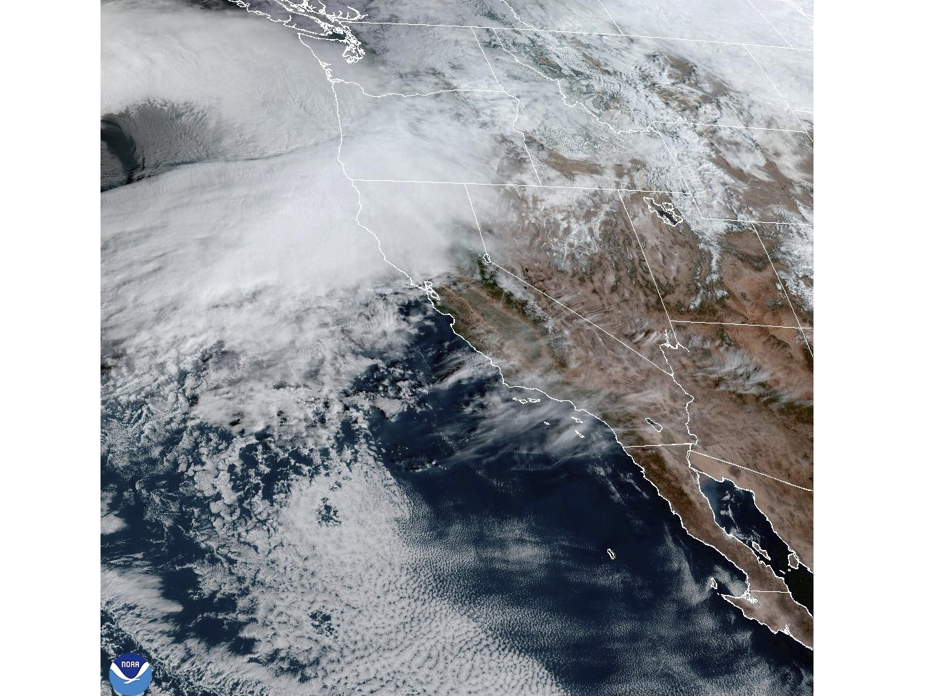caption: This satellite image Tuesday shows weather gathering in northern California and the Pacific Northwest.