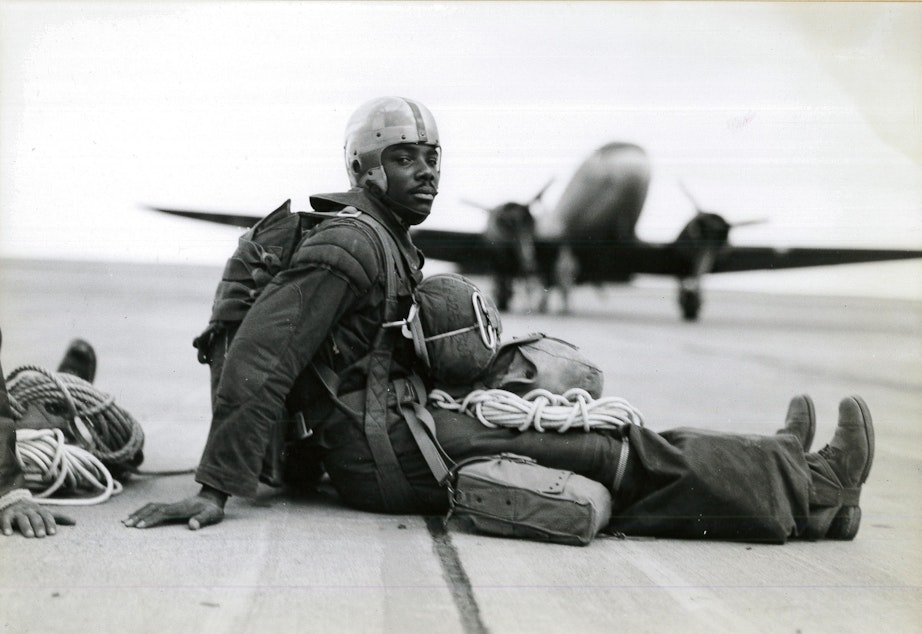 caption: A trooper in full gear waits for the order to board ship at Pendleton Army Airfield in summer 1945.
