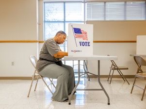 caption: A voter fills out a ballot in Jackson, Miss., on Tuesday. Federal and local officials have worked closely with researchers to track rumors and conspiracy theories in recent elections but that cooperation is fading under pressure from conservatives.