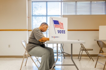 caption: A voter fills out a ballot in Jackson, Miss., on Tuesday. Federal and local officials have worked closely with researchers to track rumors and conspiracy theories in recent elections but that cooperation is fading under pressure from conservatives.