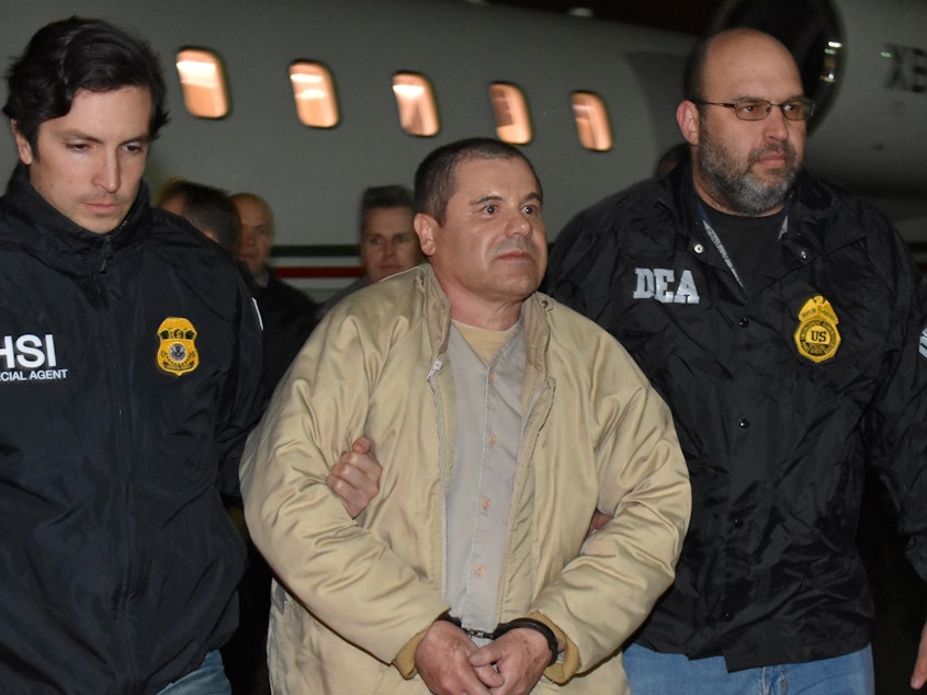caption: A U.S. court has sentenced drug lord Joaquín "El Chapo" Guzmán to a life term plus 30 years in prison. Here, Guzman is seen arriving in New York in January 2017, after his extradition from Mexico.