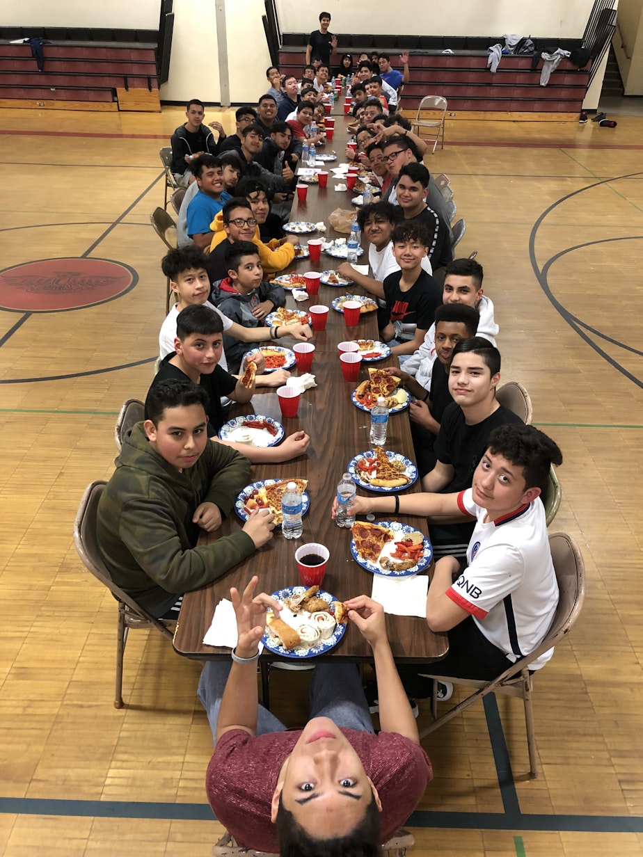 caption: Every first Friday of the month, members of Los Siete get together in Chinook Middle School's gym.