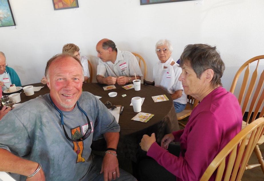 caption: Roger Stocker joins a gathering at the Greenwood Alzheimer's Cafe. He was diagnosed with dementia three years ago.