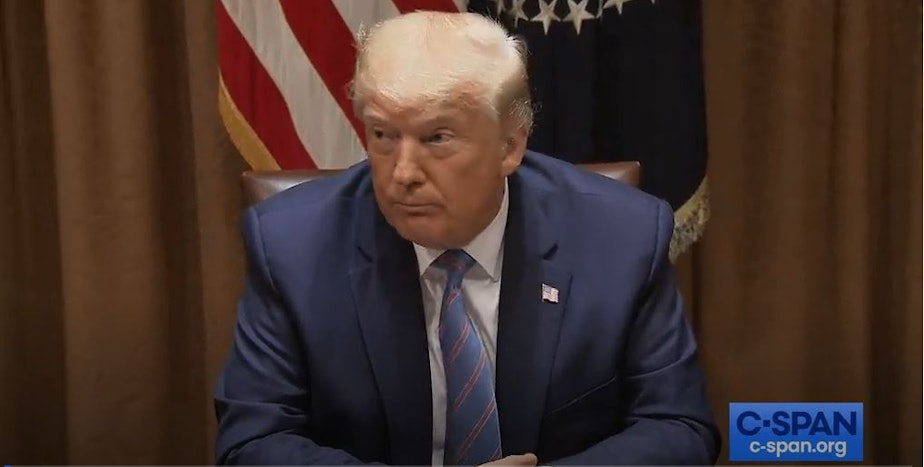caption: In this screenshot from C-SPAN, President Trump answers questions from reporters at a White House roundtable event on Monday. He used the occasion to criticize Washington state officials over the ongoing protest on Seattle's Capitol Hill.