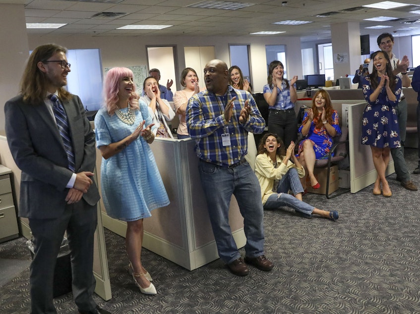 caption: Tampa Bay Times reporters Corey G. Johnson, right, Rebecca Woolington, center, and Eli Murray, left, are announced as the winners of the Pulitzer Prize for investigative reporting on Monday. The winning series, "Poisoned," exposed dangers at Florida's only lead smelter.