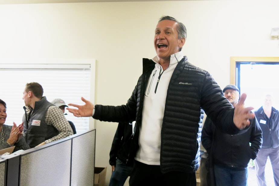 caption: Dino Rossi speaks to supporters Saturday in Issaquah before they launch a get-out-the-vote effort in the waning days of the campaign.