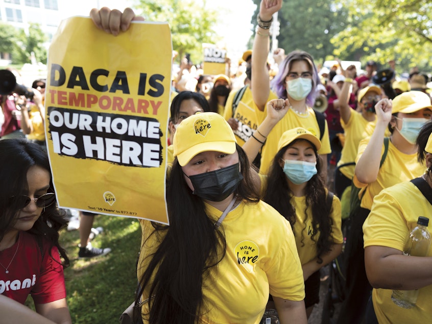 caption: Susana Lujano, left, a dreamer from Mexico who lives in Houston, joins other activists to rally in support of the Deferred Action for Childhood Arrivals program, also known as DACA, at the Capitol in Washington, Wednesday, June 15, 2022.