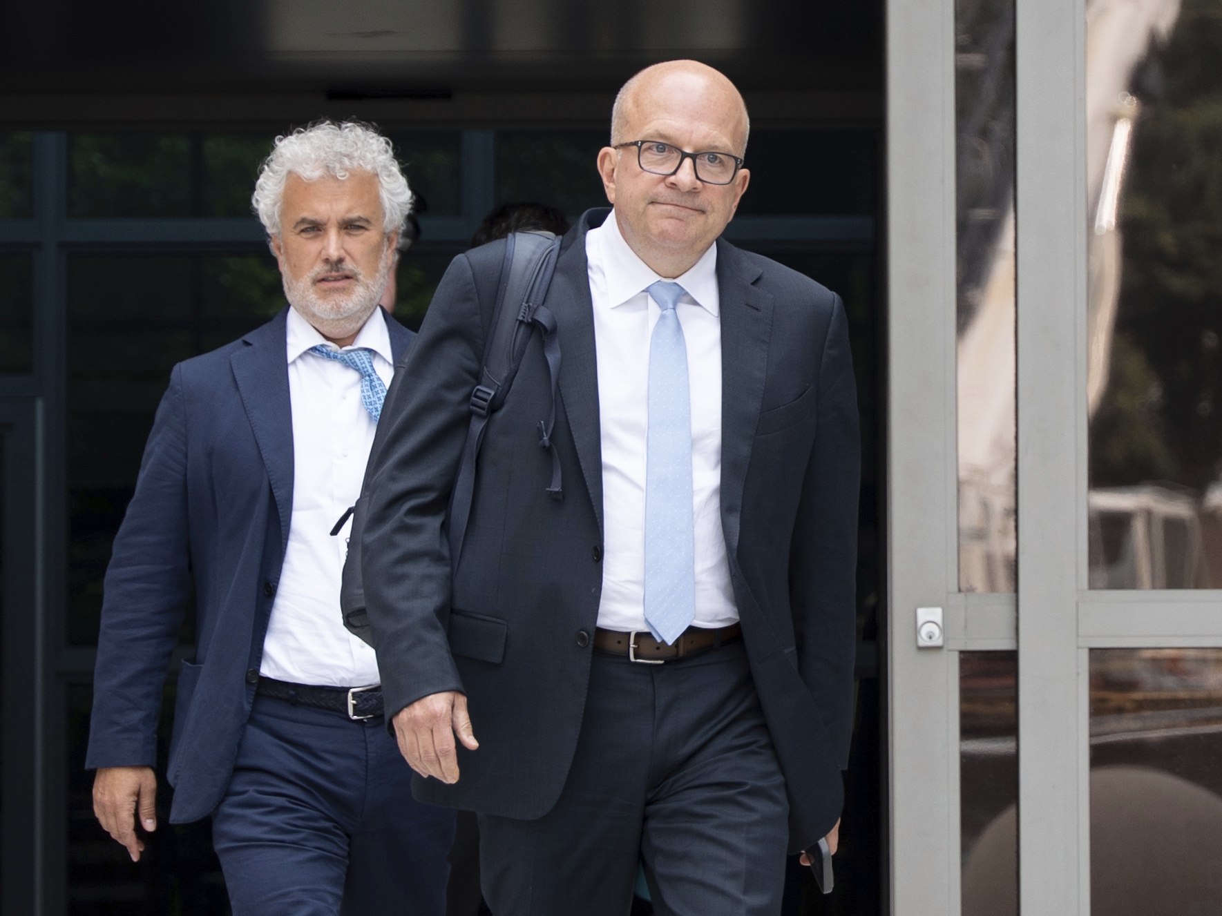 caption: Former Meta board member and former White House Chief of Staff Jeffrey Zients, left, exits the Leonard L. Williams Justice Center after testifying in a shareholders' lawsuit against current and former Meta leaders on Wednesday, July 16, 2025, in Wilmington, Del.