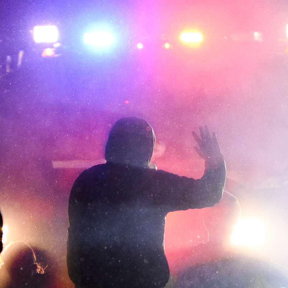 caption: Protesters confront law enforcement on April 13 outside the police headquarters in Brooklyn Center, Minn., over the fatal shooting of 20-year-old Daunte Wright by an officer. The NAACP Legal Defense And Education Fund is asking the Justice Department to suspend local police grants, citing ongoing killings of Black people like Wright by police.