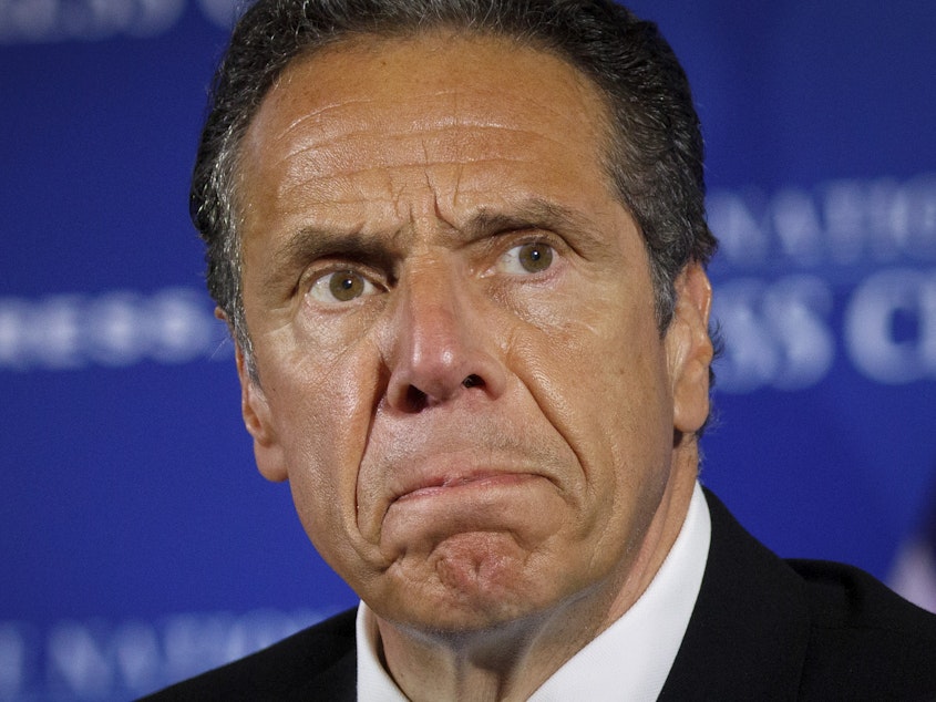 caption: Andrew Cuomo, seen last year during a news conference, now faces a criminal complaint. It charges the former New York governor with a misdemeanor sex crime.